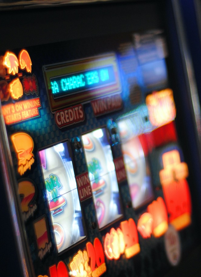 Close up image of a lit-up slot machine
