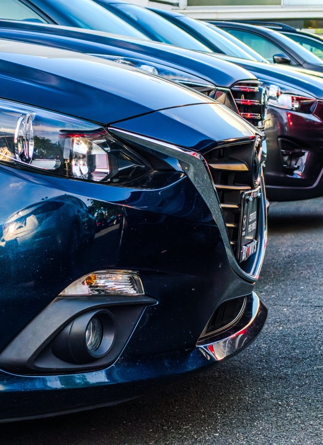 Close up image of cars parked in a parking lot