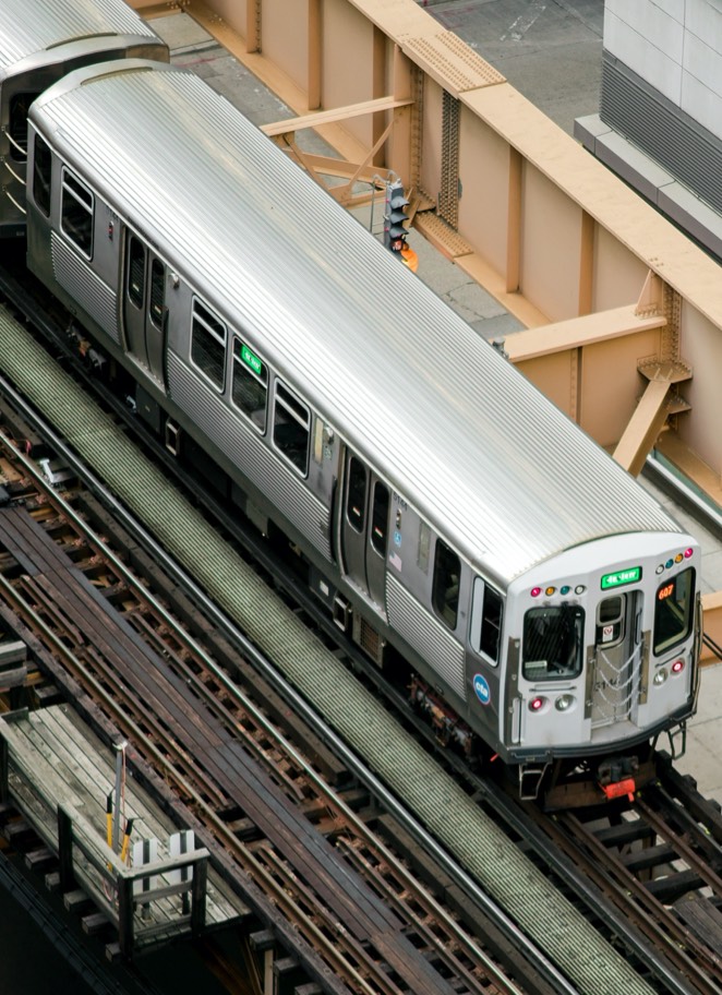 Overhead view of a train on elevated tracks