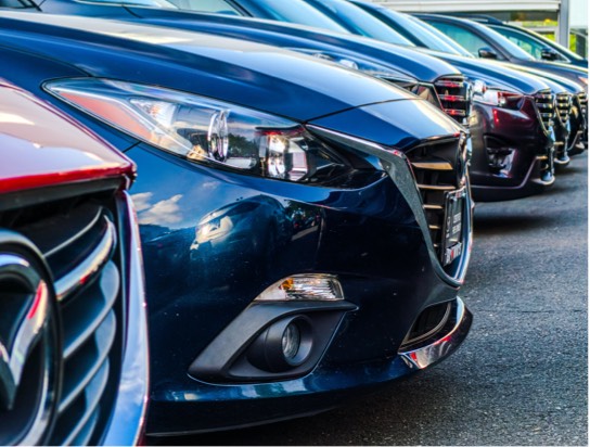 Close up image of cars parked in a parking lot