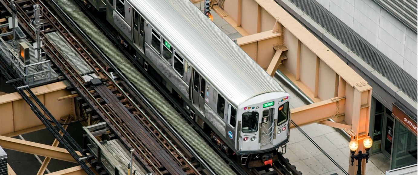 Overhead view of a train on elevated tracks