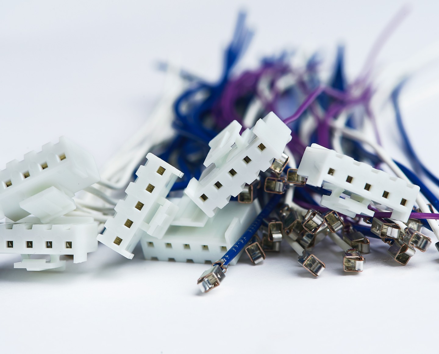Close up photo of blue, white and purple VH Series Harness pieces