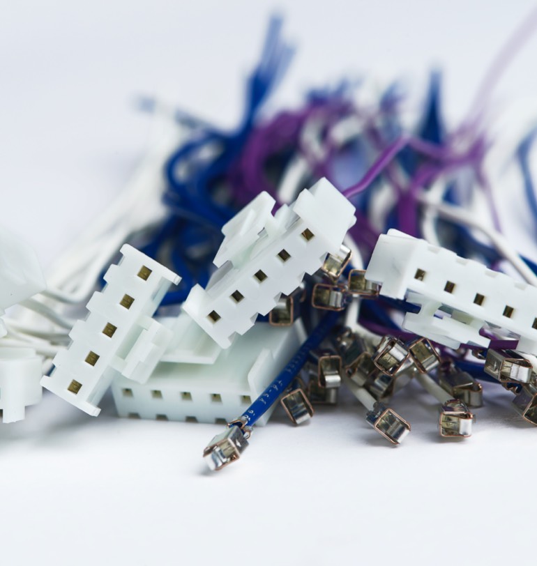 Close up photo of blue, white and purple VH Series Harness pieces